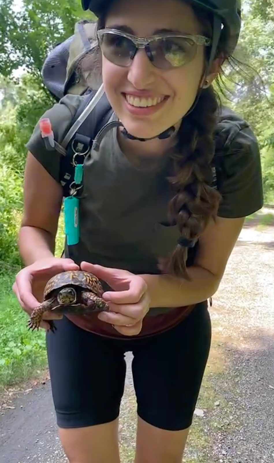 woman with sunglasses and turtle